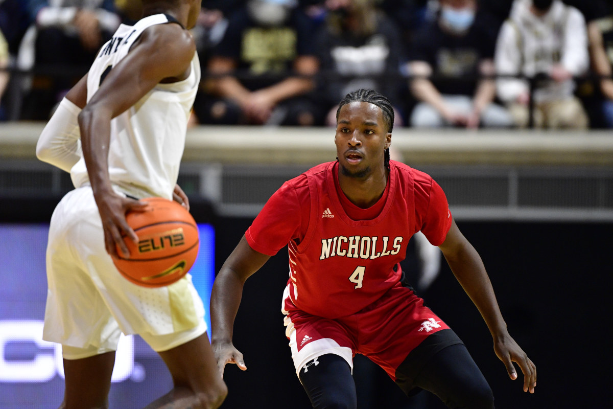 A Nicholls State player defends Eric Hunter Jr.